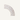 Close up - showing a decorative corner trim piece featuring a curved border with a repeating spiral and zigzag pattern, shown on a solid off-white background. 