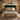 A styled bedroom scene featuring a bed with a tall, deep green velvet headboard, dressed in cream linens, patterned pillows, and a green throw blanket, with a wooden bench at the foot of the bed.