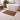 Bathroom with a freestanding bathtub, Large teak mat, and decorative items.