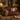 washington 2 seater aged leather sofa, styled in a warm living room with throw rugs and soft lighting